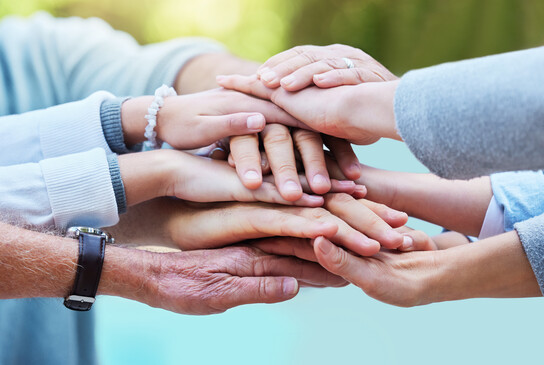 Family, trust and hands together for teamwork, agreement or collaboration in solidarity in garden. Group of people in community gathering piling hand for unity, celebration or love in partnership